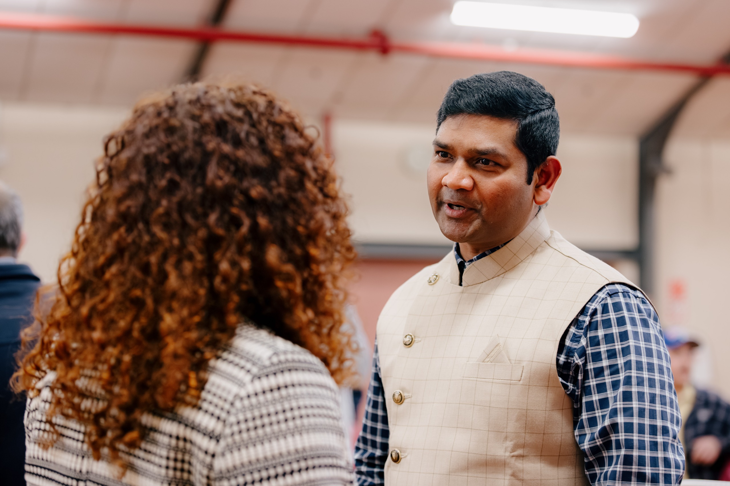 A man and woman speaking